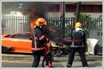 Lamborghini catches fire after crashing into lamp post