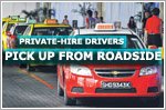 Private-hire drivers picking up fares from roadside