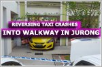 Reversing taxi crashes into walkway between two blocks at Jurong West Street 81