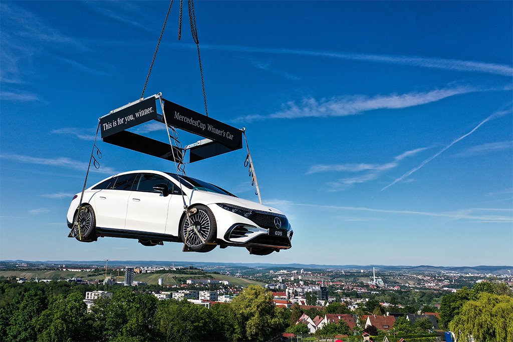 Mercedes hangs an EQS right above a tennis competition