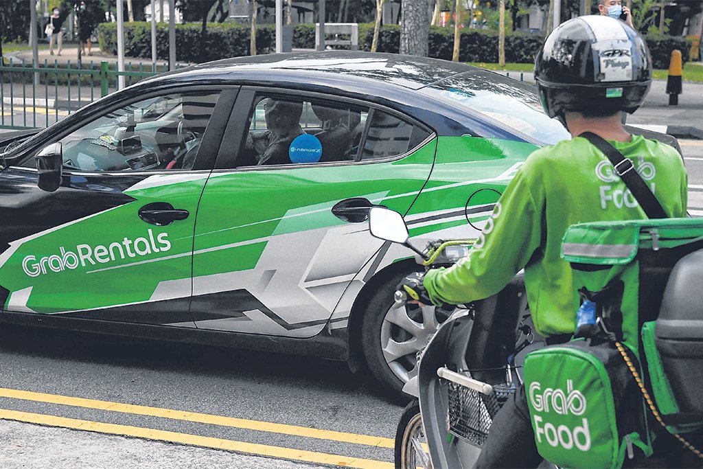 MOM to look into strengthening protections for delivery riders, PHV and taxi drivers