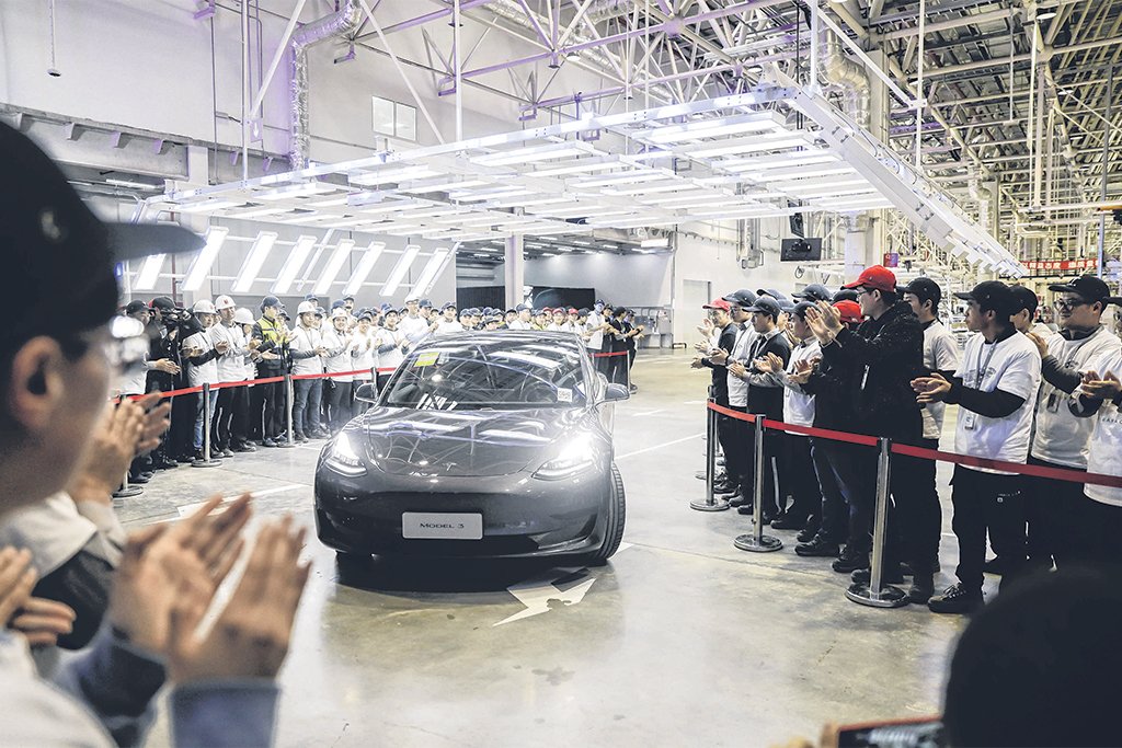 Tesla sets sales record again with nearly one million cars delivered in ...