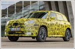 MINI reveals first camouflaged images of electric Countryman